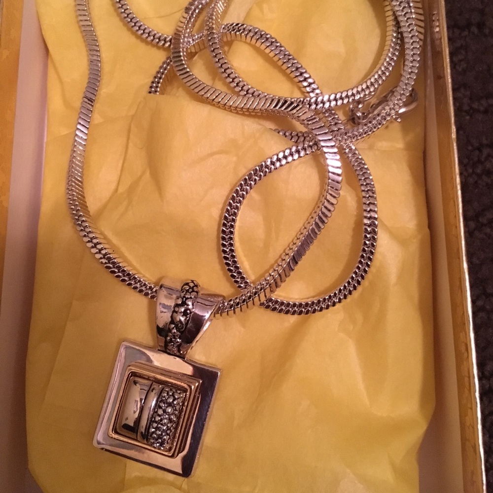 Gold and silver tone pendant with necklace